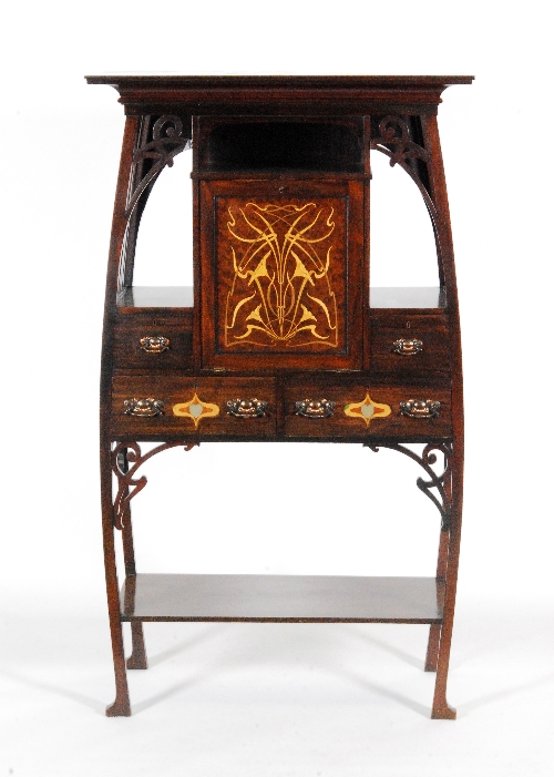 Unknown - A mahogany and marquetry inlaid side cabinet of bombe form with a central fall-front