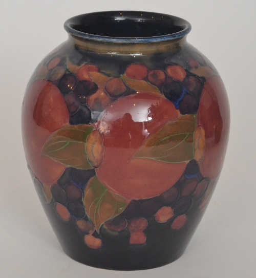 William Moorcroft - Pomegranate - A vase of swollen ovoid form decorated with a band of whole fruit