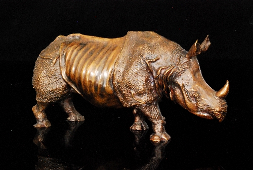 Unknown - A contemporary bronze study of a standing Indian rhinoceros, length 33cm, unmarked.