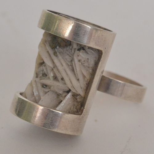 Unknown - A 1960s silver ring with plain shank mounted with a rectangular block filled with a panel