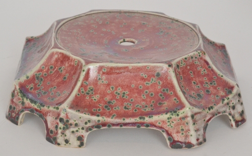 Ruskin Pottery - A high fired stand of segmented form decorated in a sang de beouf glaze with