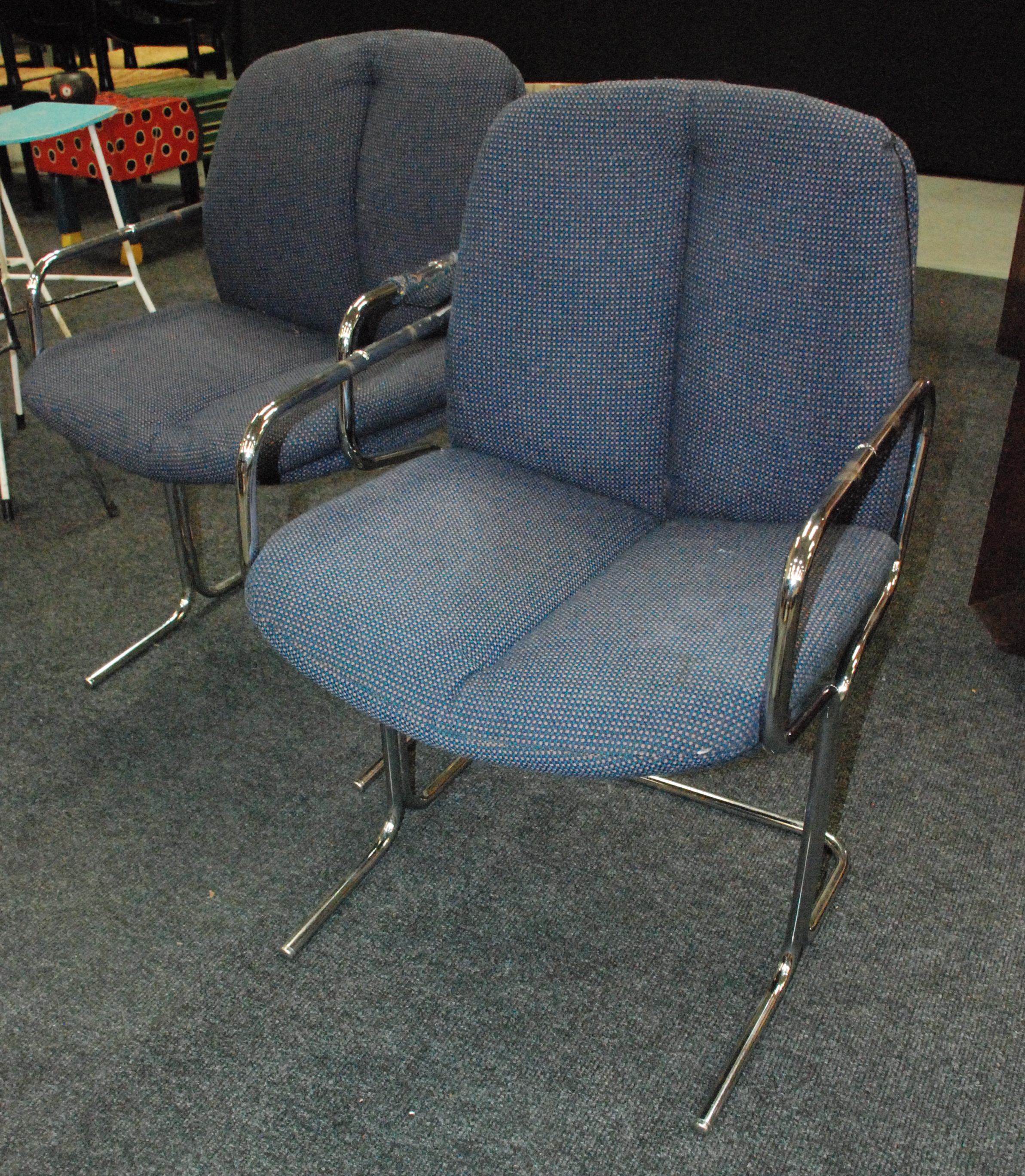 Pieff - Four chromium plated tubular framed group or dining chairs, upholstered in blue cloth