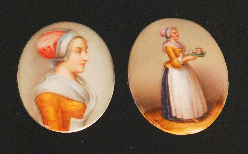 Two late 19th to early 20th Century oval panel plaques both hand-painted with studies of the `The