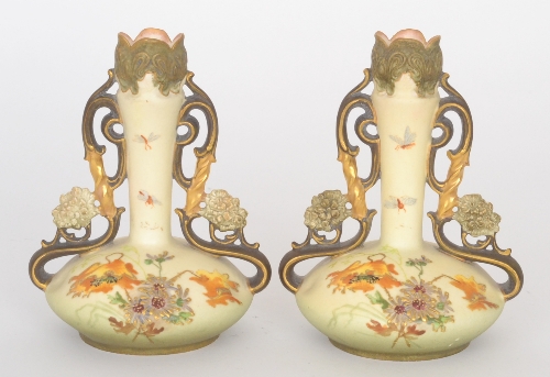 A pair of late 19th Century Ernst Wahliss Turn posy vases each decorated with enamel and gilt
