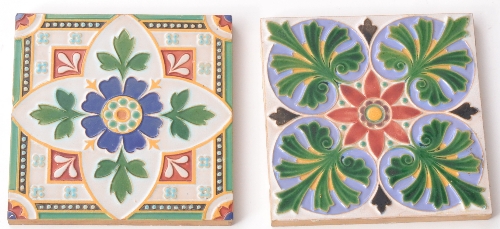 Two 6 inch Minton & Co dust pressed majolica tiles circa 1850 the first with a central red flower