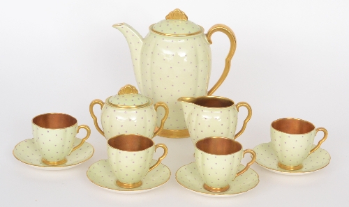 A 1930s Art Deco Carlton Ware coffee service comprising coffee pot, milk jug, sucrier and four cans