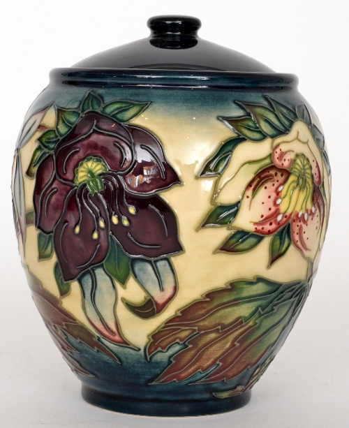 A Moorcroft Pottery Hellebore pattern vase and cover designed by Rachel Bishop and decorated with