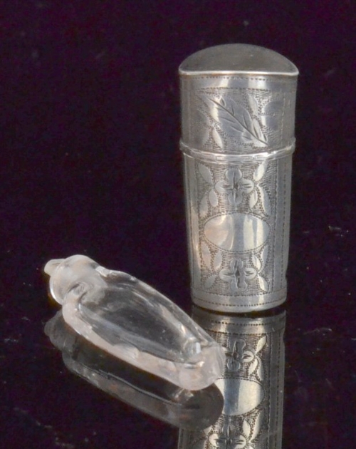 An early 19th Century part hallmarked silver scent bottle sleeve and cover with bright cut foliate