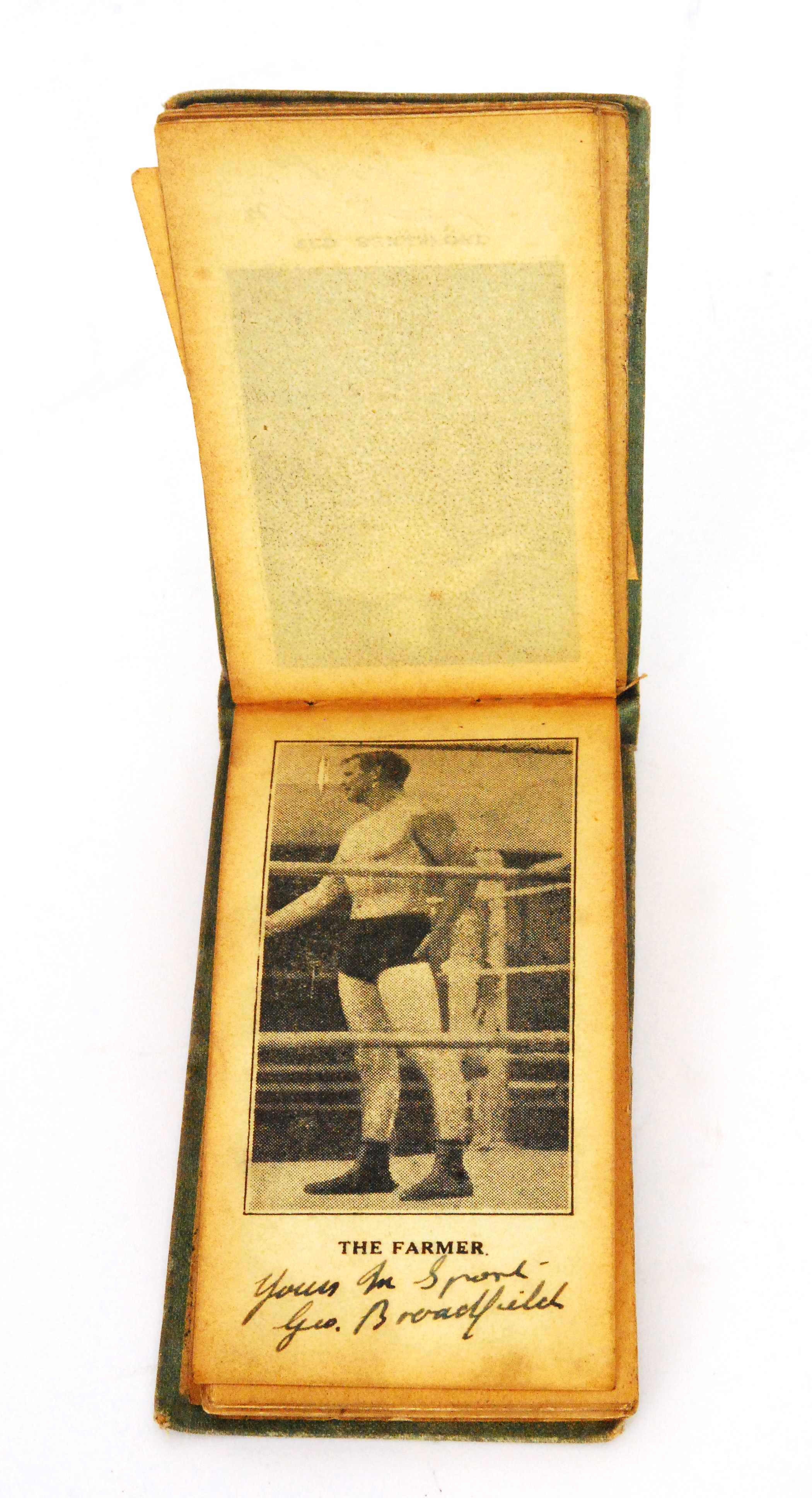 A small 1920s to 1930s printed photographic flip album of wrestlers to include signed examples by