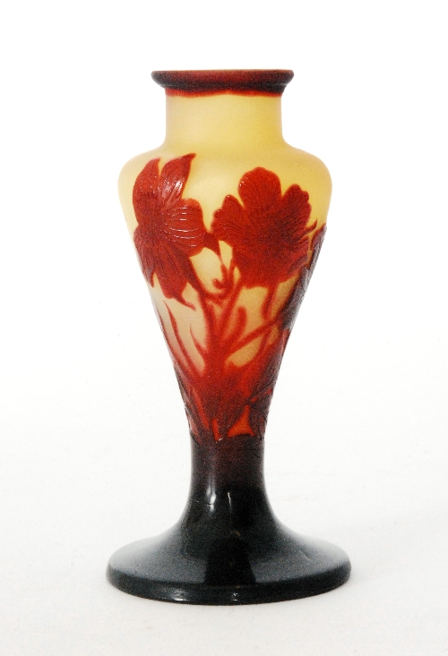 Emille Galle - A late 19th Century cameo glass posy vase with wide circular spread foot rising to a