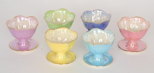 A harlequin set of six 1930s Maling lustre grapefruit or sundae dishes each of footed form with