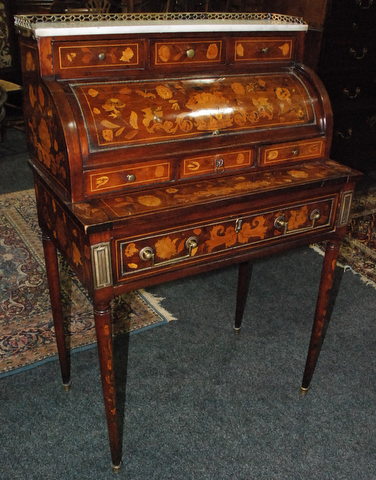 An 18th Century Dutch floral marquetry inlaid cylinder bureau, white marble top with brass gallery