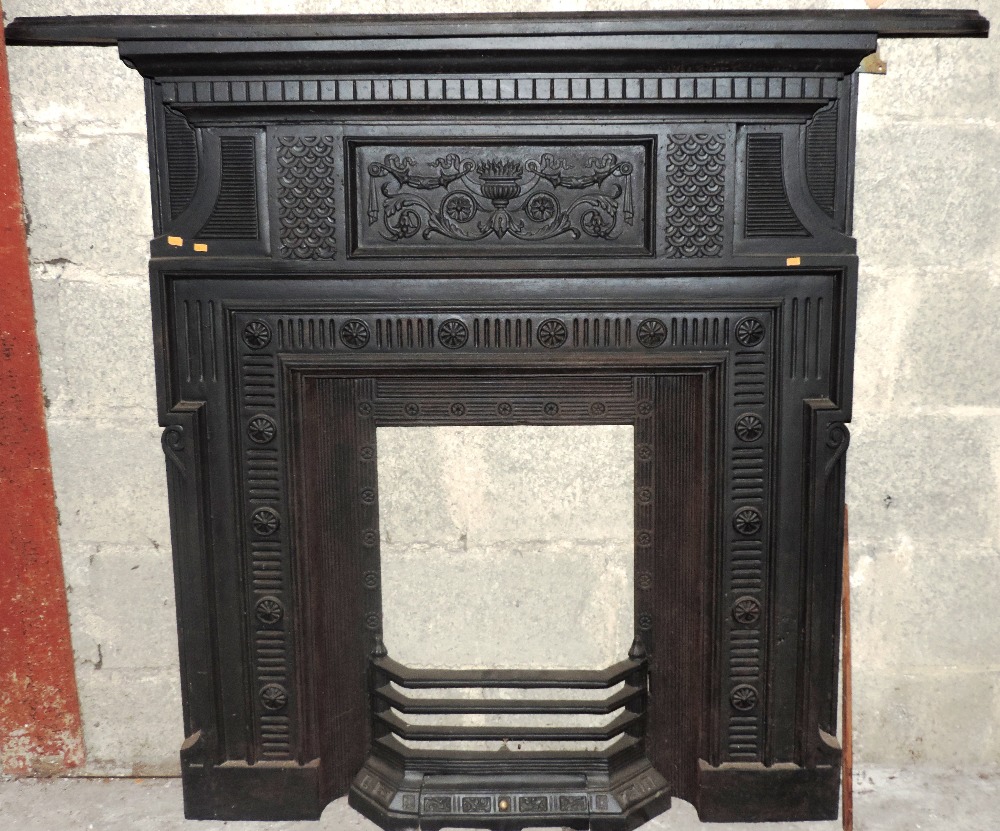 An attractive old cast metal Fireplace, with decorated urn and other designs. (1)
