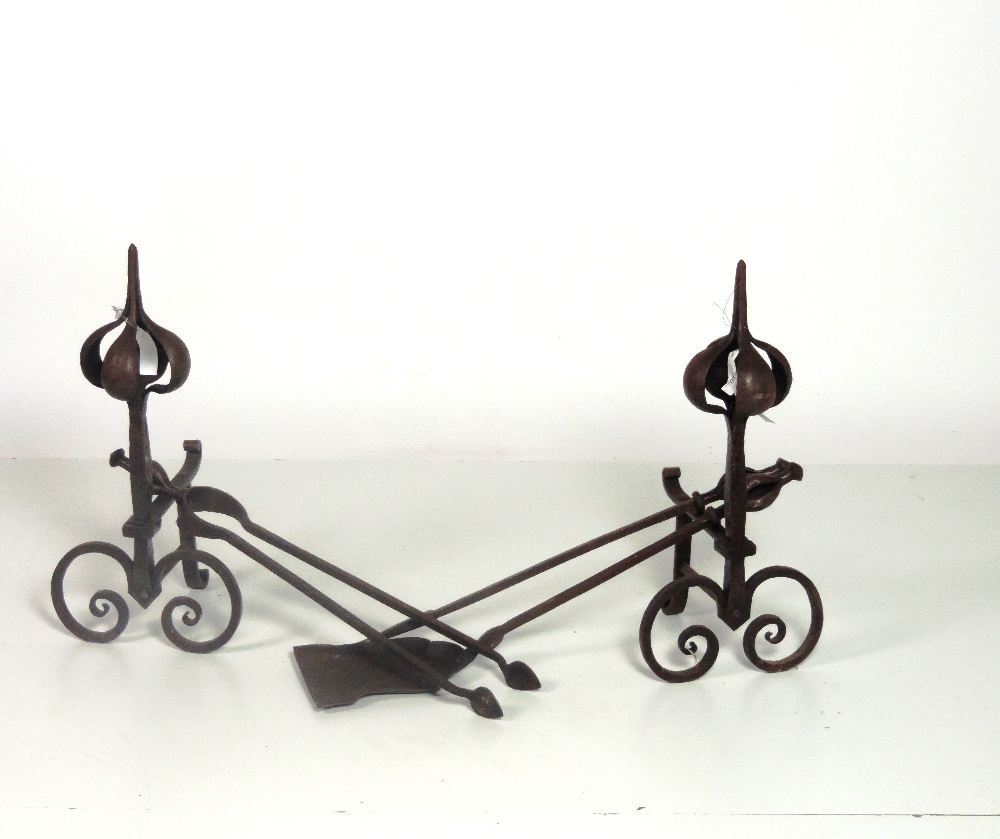 An unusual set of wrought iron Fire Irons, and a matching pair of Fire Dogs en suite. (5)