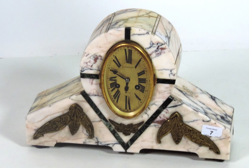 An unusual Art Deco speckled white marble Mantle Clock, with an oval brass dial, signed Au.