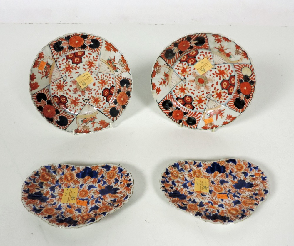 A pair of attractive Imari Plates, 21cms (8 1/4") and a smaller pair of similar kidney shaped