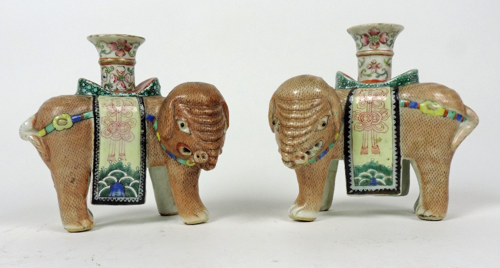 An extremely fine pair of 19th Century Chinese porcelain Ceremonial Elephant Vases, decorated in