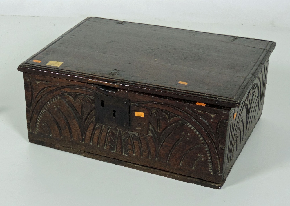 An 18th Century oak Bible Box, with carved front and side panels. (1)