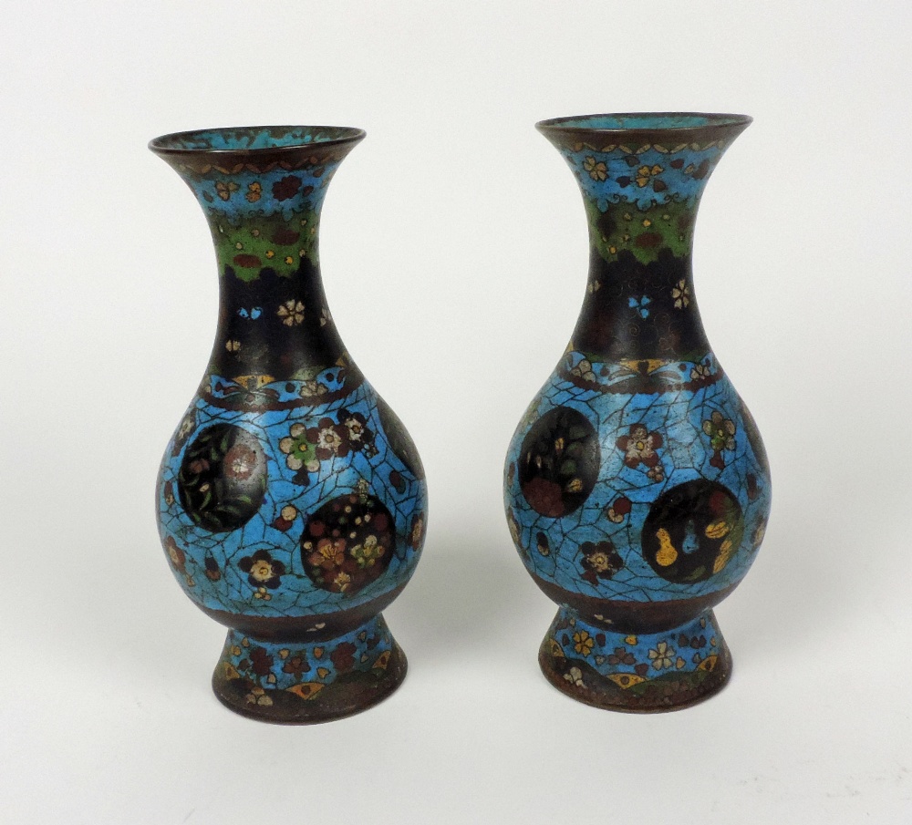 A pair of small late 19th Century blue ground cloisonne Vases, 22cms (8 1/2") high. (2)