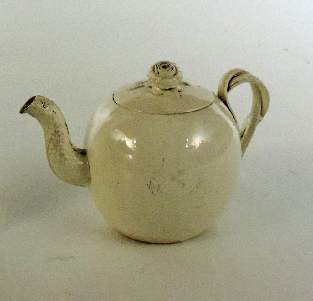 A small bullet shaped Wedgwood creamware Teapot, and lid, with double strap handle. (1)