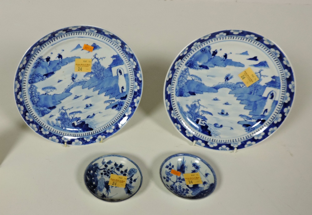 An attractive pair of Chinese blue and white Plates, 24cms (9 1/2")d, and a pair of similar small
