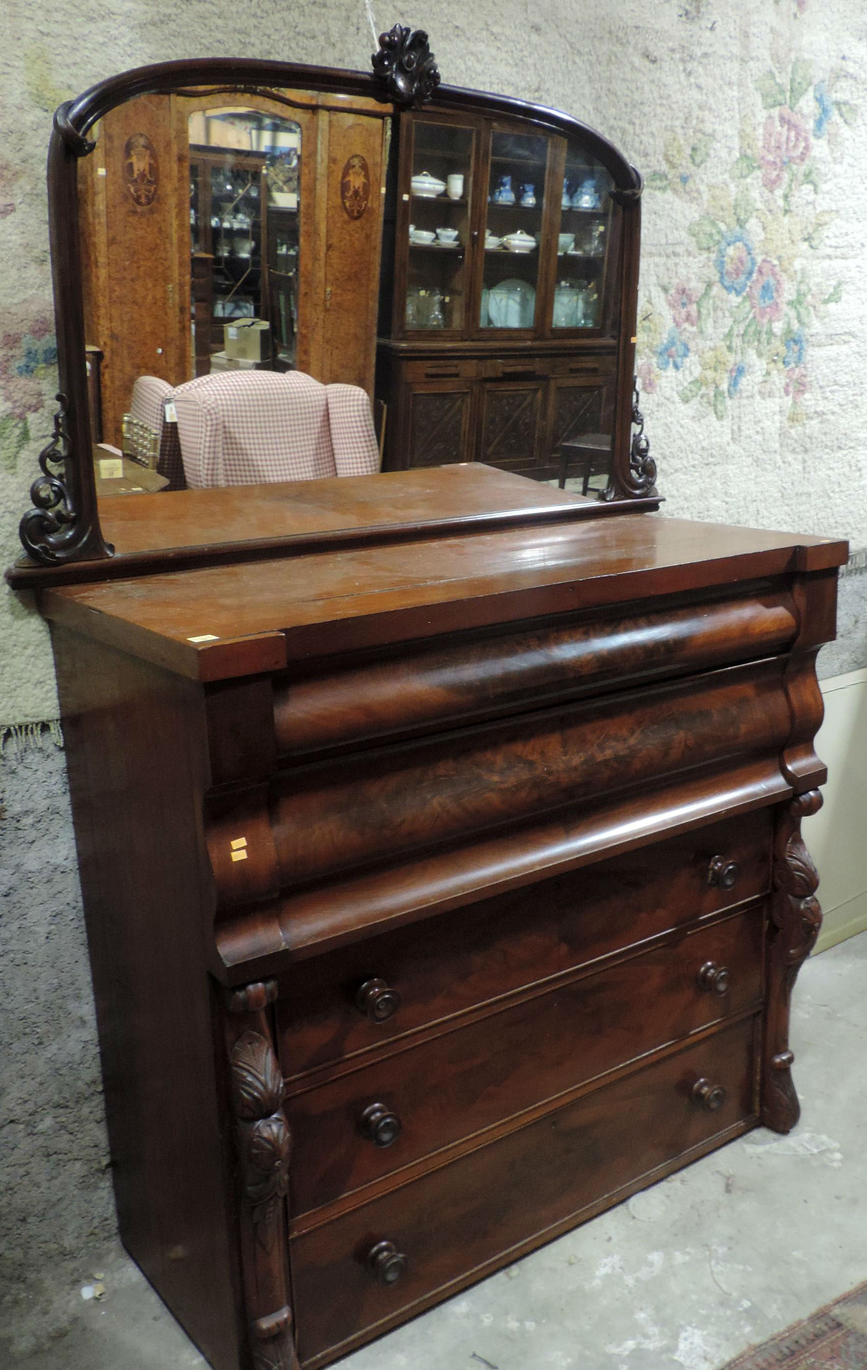 An arched top Victorian mahogany Overmantel, with carved decoration; and an old figured mahogany