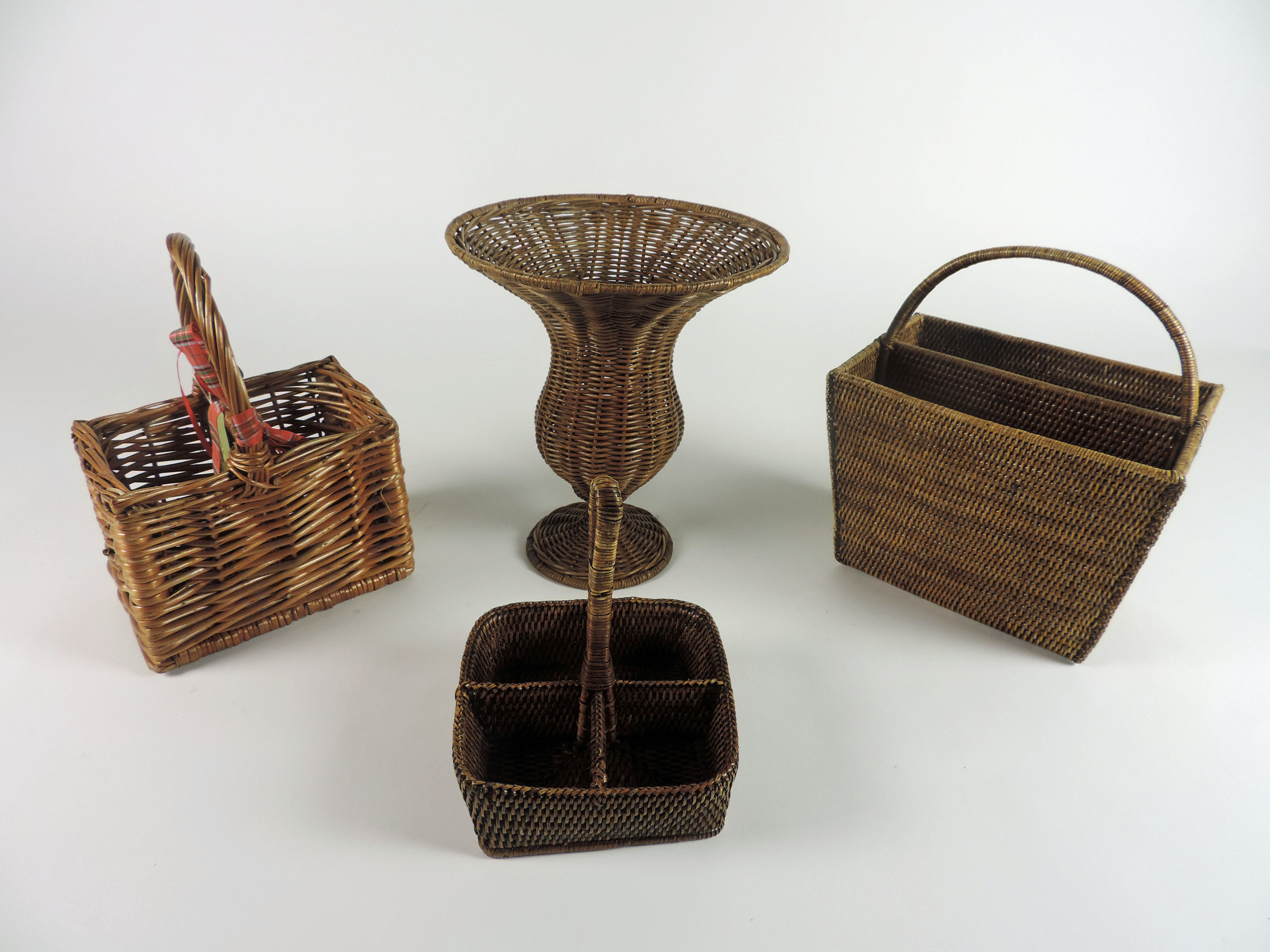 A collection of good Wicker-Work items, including two tier table, a coffee table, some baskets etc.,