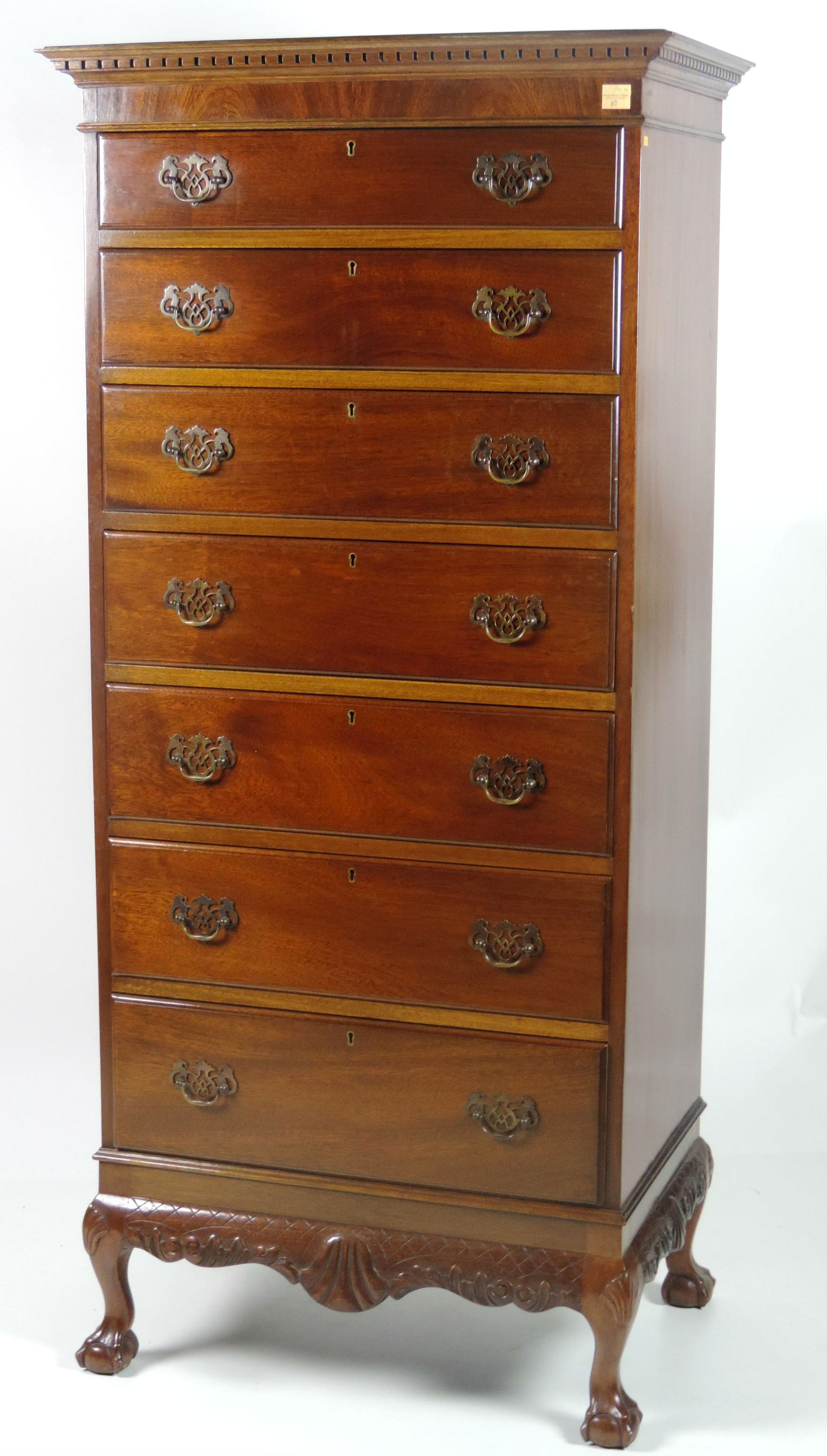 A very good Chippendale style carved mahogany Tallboy, by Hicks, Bow Lane, Dublin, the dentil