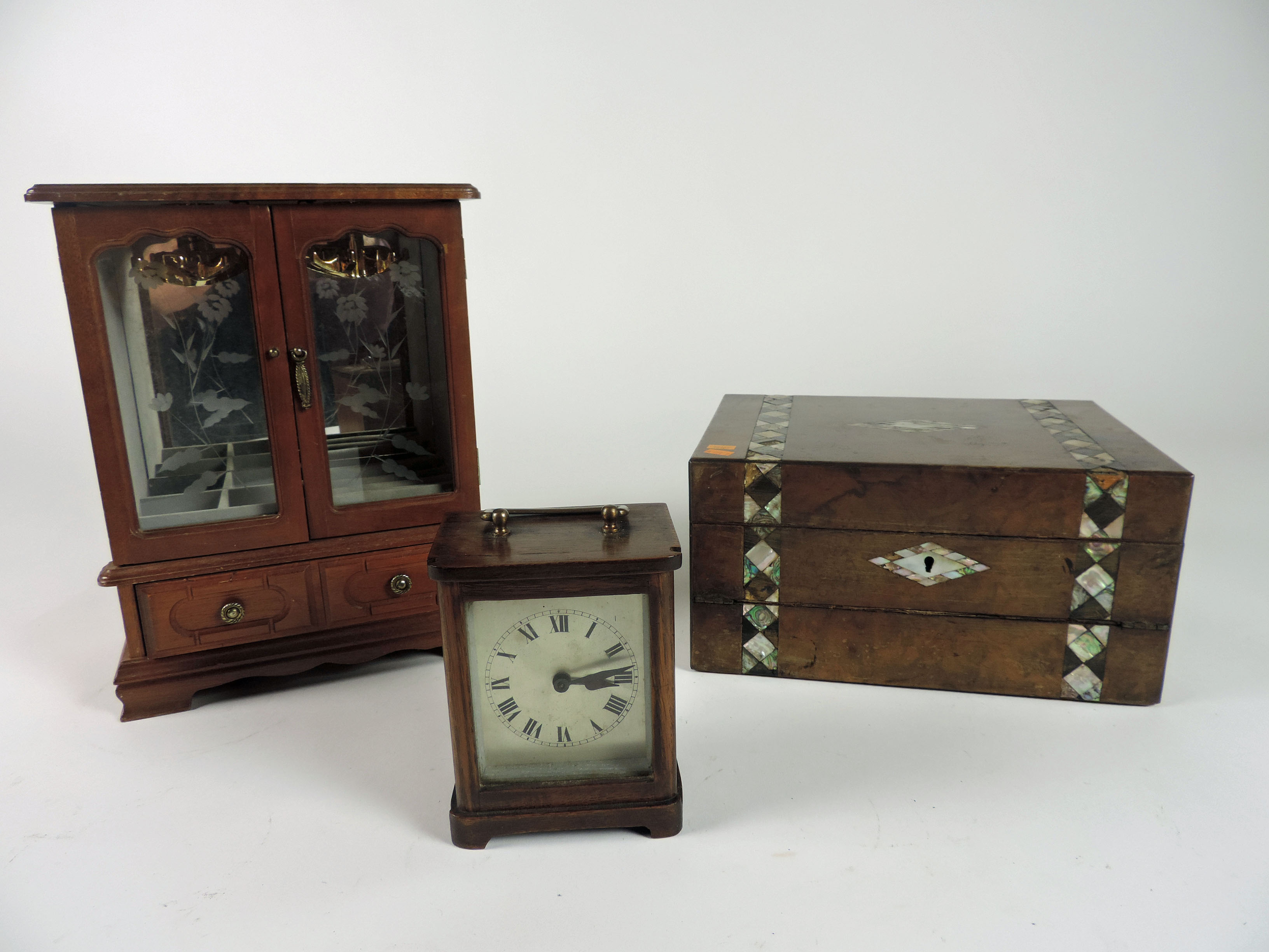 A small oak cased Carriage Clock, an attractive miniature Table Cabinet for jewellery etc., and a