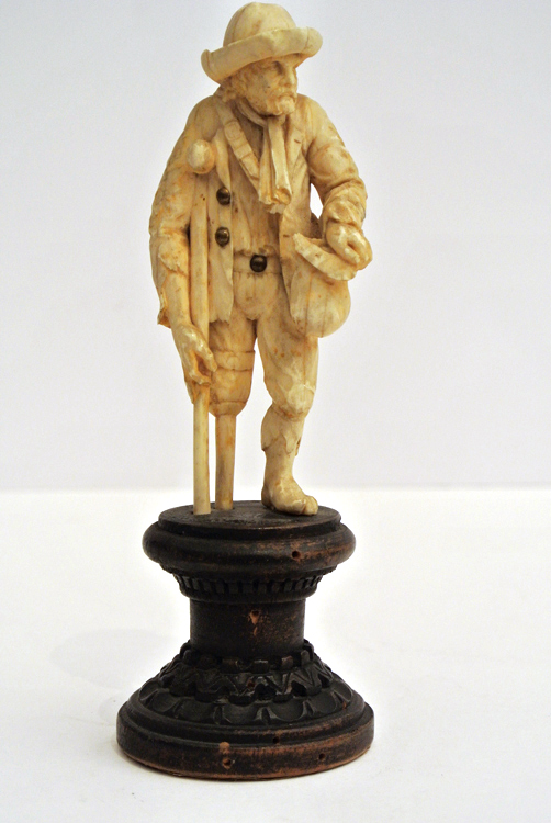 German School 19th century. A fine carved ivory sculpture depicting `an old farmer with shoulder