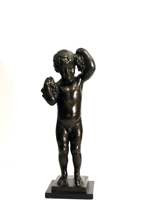 Josè Clarà (Spain 1878 - 1958). A fine burnished bronze sculpture depicting `small Bacchus`, signed