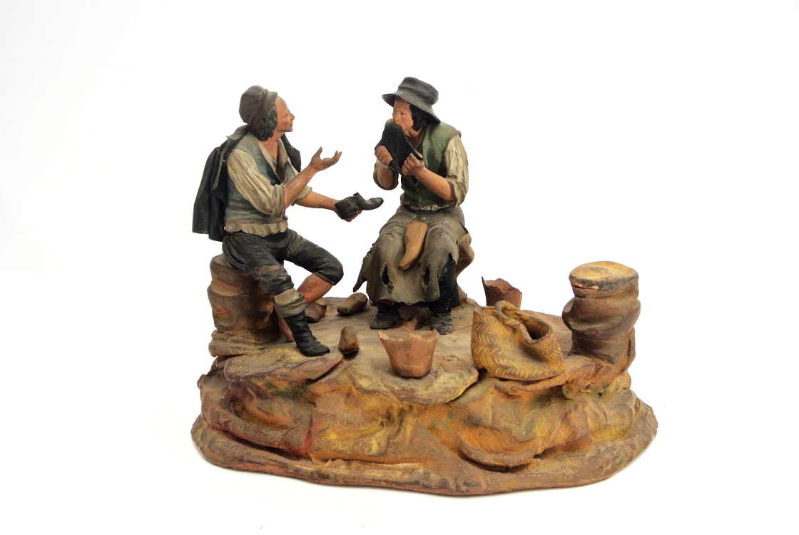 Italian School 18th century. A beautiful polychrome terra cotta sculpture depicting a `shoesmaker`,