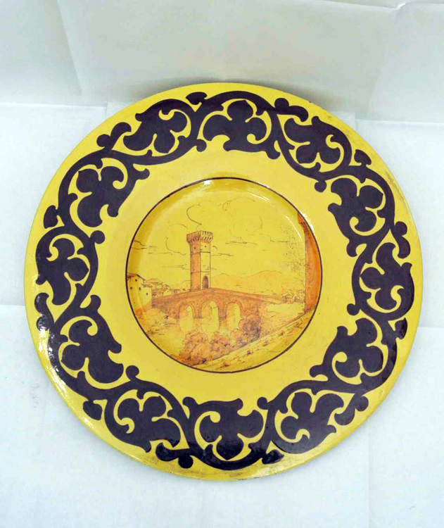 Italian School beginning of 20th century. A decorative polychrome ceramic plate depicting a `