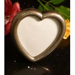Heart shaped silver photo frame.