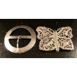 Two silver buckles circular planished pi