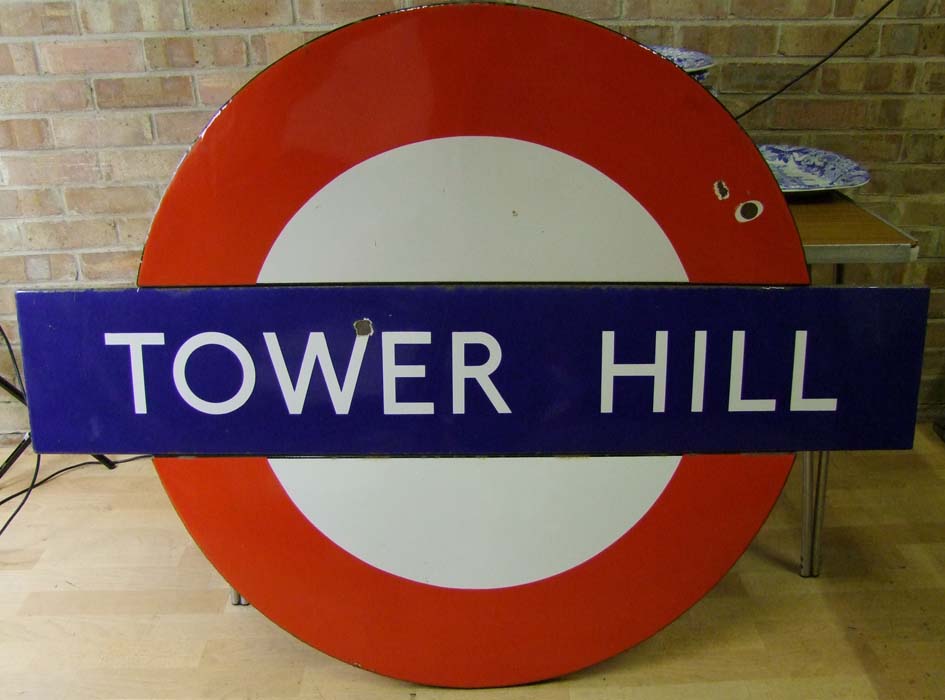 An enamelled underground station sign `Tower Hill`, 107cm x 142cm (42in. x 56in.). Live bidding