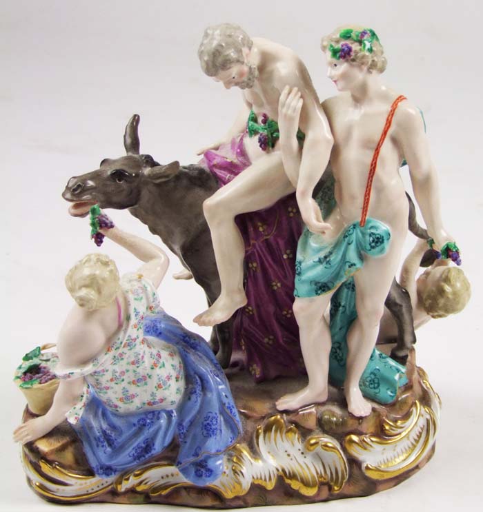 A Meissen figure group of Bacchus and Silena with a donkey, with two figures seated on the ground,