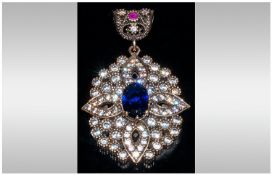 Large Gemset Openwork Pendant, Set With A Central Blue Sapphire Coloured Stone Surrounded By White