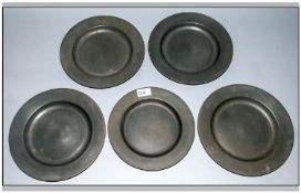 Five Pewter Dinner Plates with touch marks to the back, 10 inches in diameter.