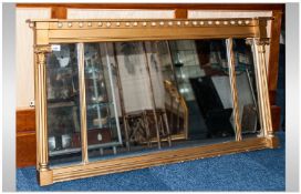 Regency Style Gilt Over Mantle Mirror of oblong shape with column sides, with an inverted ball