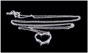 9ct White Gold Heart Shaped Pendant. suspended on a 9ct gold chain. Chain a/f
