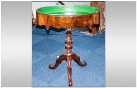 A French Walnut Antique Jardiniere Stand Table with an oval shaped top and metal lined. On a turned