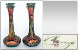 James Macintyre/ William Moorcroft Signed Pair of Vases, `Cornflower` design with unusual pink