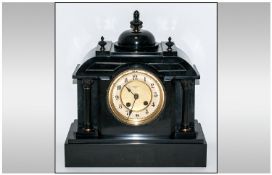 French 19th Century Black Marble Eight Day Striking Mantel Clock, strikes on a gong; working order