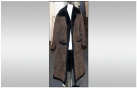 Ladies Full Length Sheepskin Coat. With tie belt and label to inside reads `Suede and Leathercraft