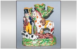 Staffordshire 19th Century Figural Spill Vase features a man holding a rabbit and club. Horse to