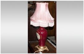 Pottery Decorative Table Lamp with red decoration, highlighted in gilt work on an ormolou round