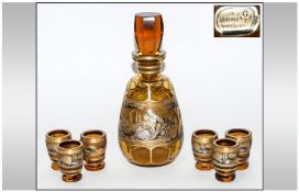 Bohemian Hand Painted Amber Glass Decanter and Six Tots Set, complete with box; decanter 10 inches