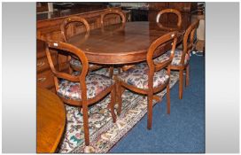 A Set Of Six Balloon Back Dining Chairs with a leaf extending dining table, 5ftx3ft 8``. Late 20th