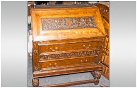 1930`s Carved Oak Glazed Bureau Bookcase with a domed shape top and grape & leaf carving. With a